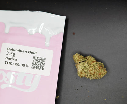 Cannabis package labeled 'Columbian Gold' with a small amount of thca flower on the side