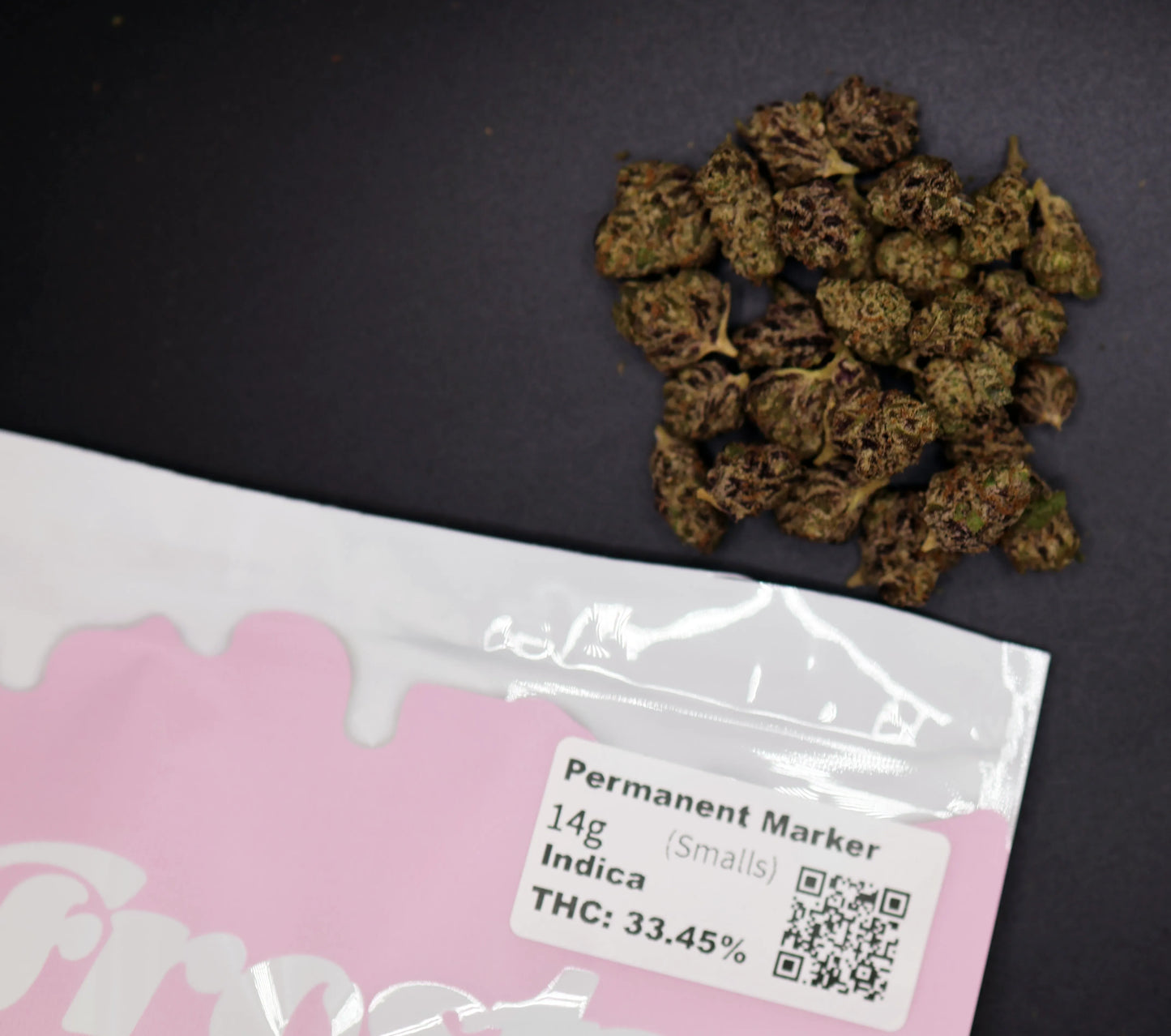 high thca indica strain permanent marker package with pile of buds next to it 