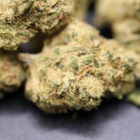 close up of pineapple express smalls buds showing high thca content with visible crystals and frosty texture
